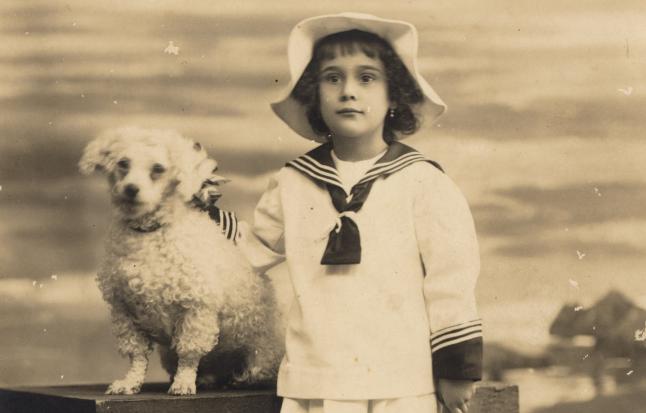 A family Canary posing with copies of this breed of dog that was originally called Tenerife